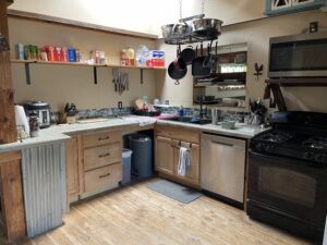 Kitchen with concrete counter top & skylight